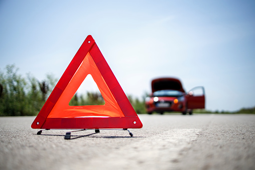 Portable warning triangle on the street - stock photo